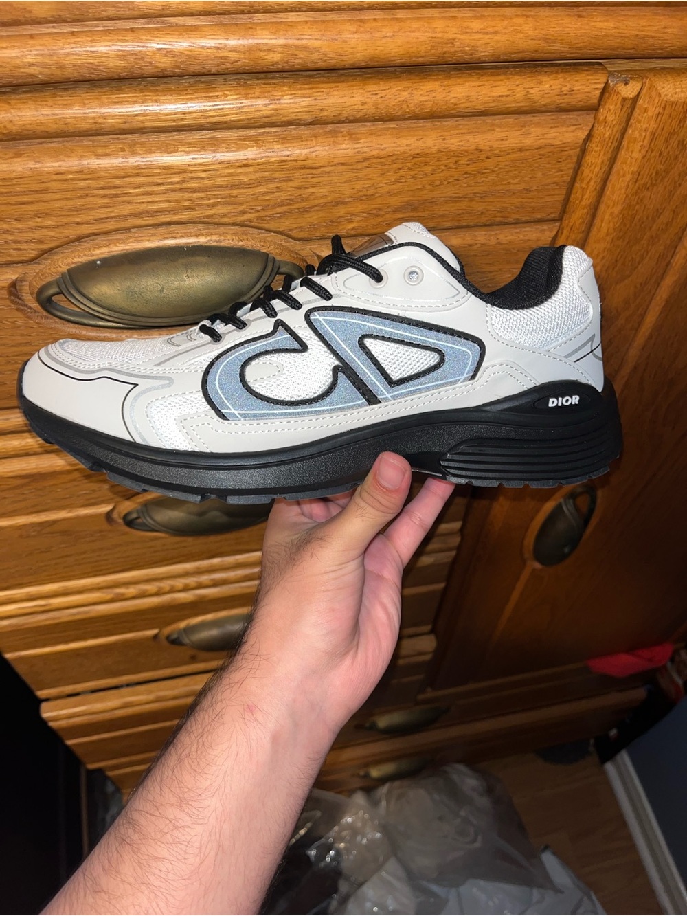 Dior Men’s White Low-Top Runner Sneaker with Black Sole and Light Blue Logo